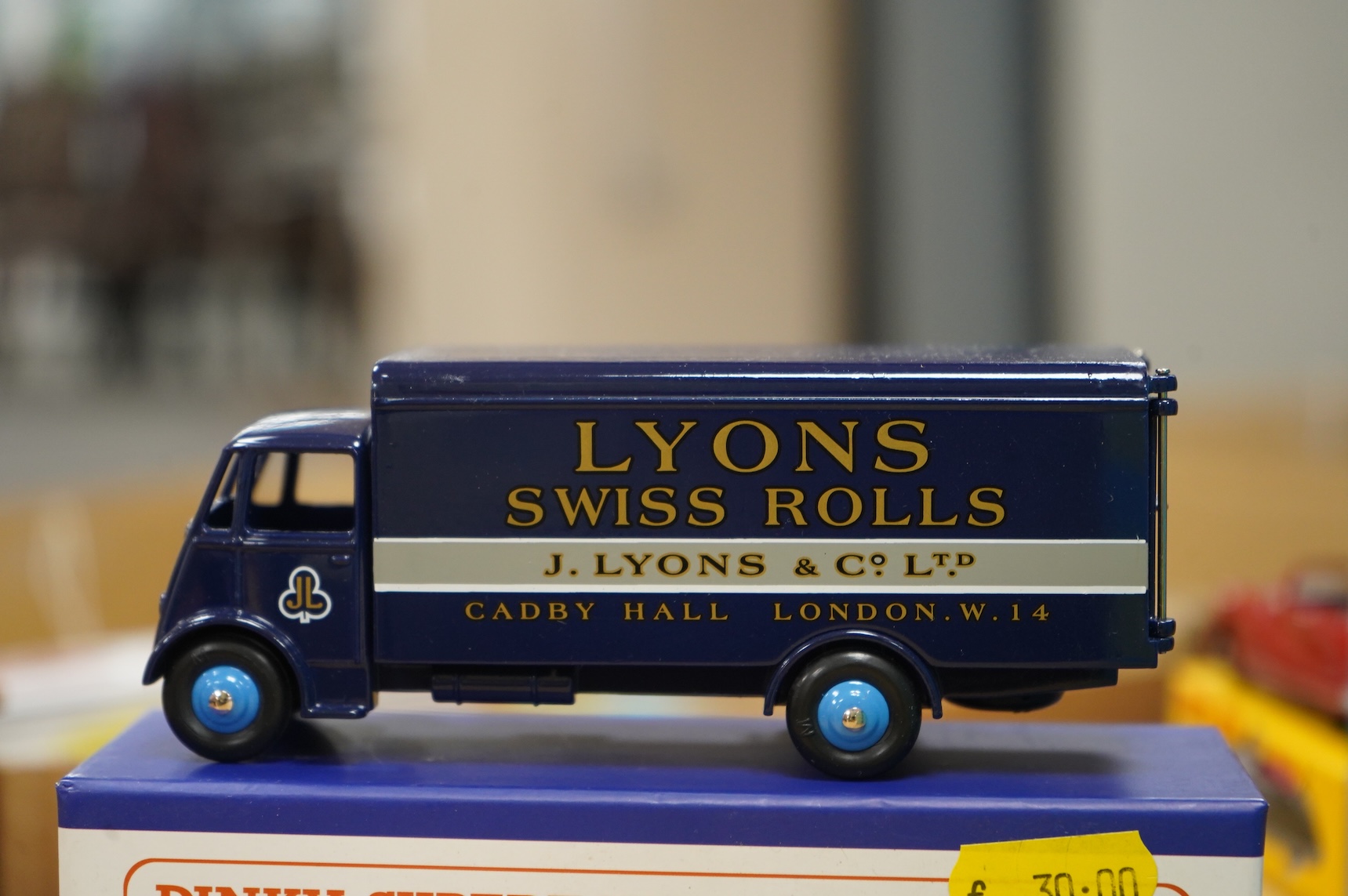 Twenty-two boxed Atlas Dinky Toys, including cars and commercial vehicles, Leyland tankers, a Foden wagon, sports cars, etc.